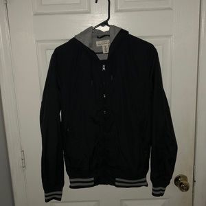 Varsity navy blue jacket with hoodie.